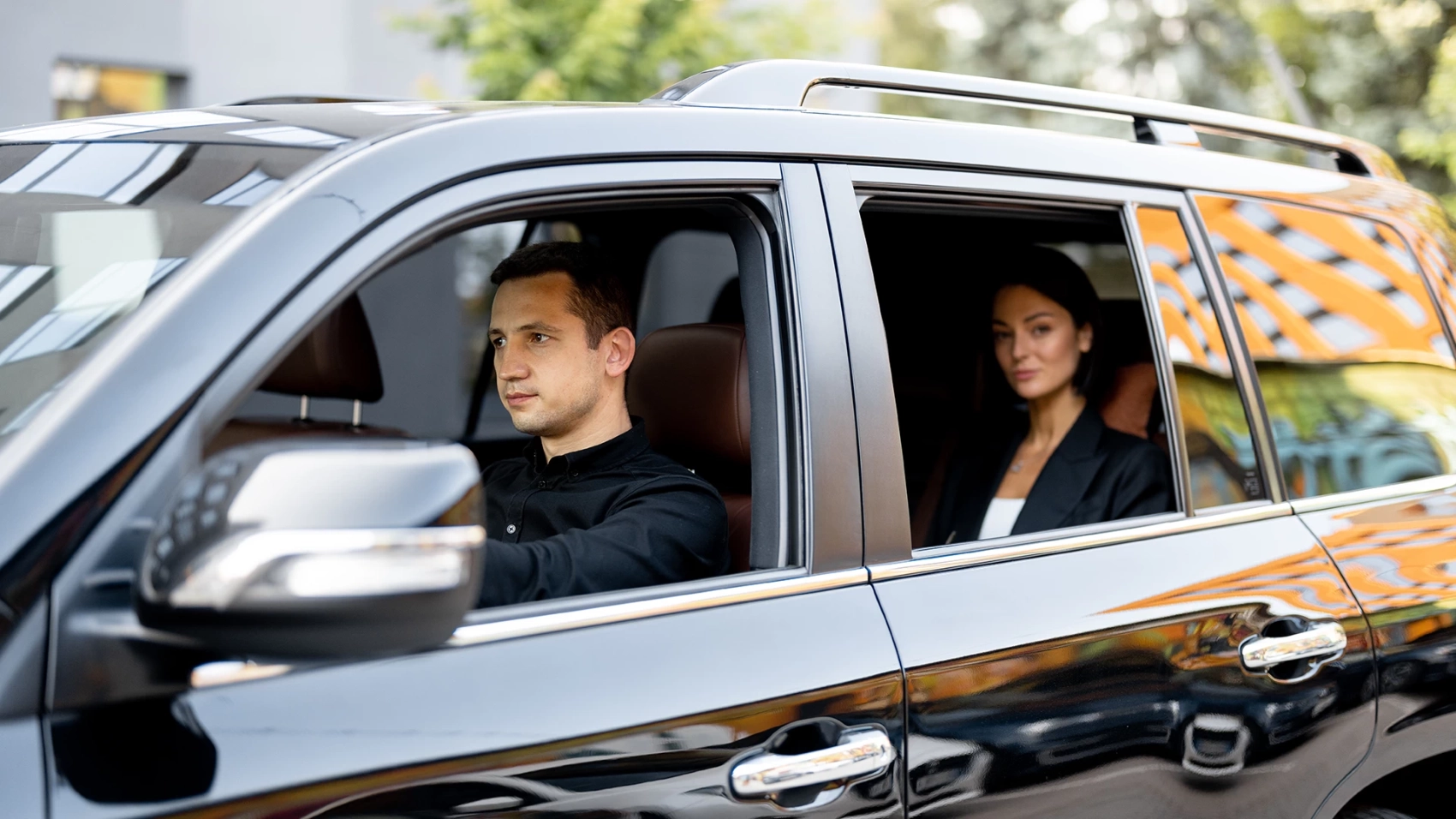 injury-law-firm-rideshare-requirements_0000s_0002_side-view-of-a-luxury-suv-vehicle-with-male-driver-2023-11-27-05-17-52