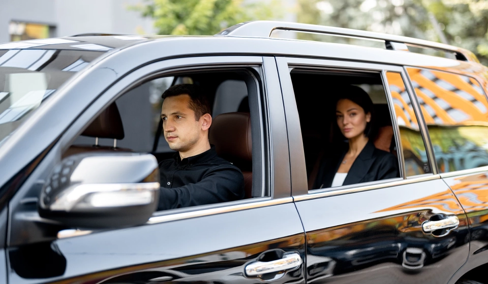 injury-law-firm-rideshare-requirements_0000s_0002_side-view-of-a-luxury-suv-vehicle-with-male-driver-2023-11-27-05-17-52