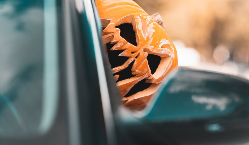 halloween-south-florida-driving-accident-attorney_0000s_0000_closeup-shot-of-a-young-man-with-a-pumpkin-on-his-2023-11-2